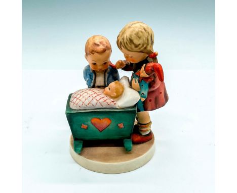 Hand painted boy and girl overlooking a new born in a crib. Hummel W Germany backstamp. Impress mark 333. Issued: 20th centur