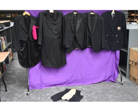 A collection of gents vintage and antique suits, tail coats and jackets.