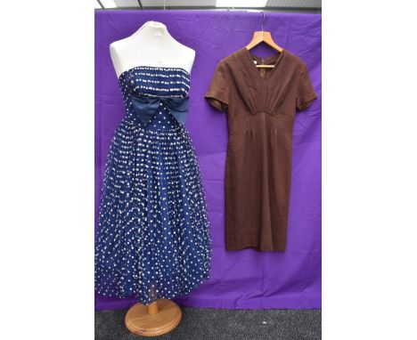 Two 1950s vintage dresses,one strapless dress having flocked white dots to tulle overlay,full skirt and back metal zipper and