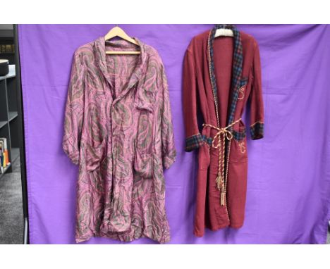 Two vintage dressing gowns including one of red wool with checked collar.
Darn to arm of patterned dressing gown and some are