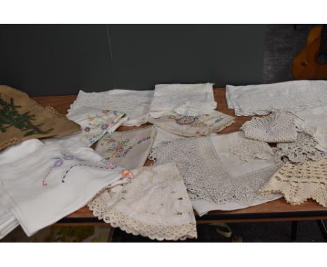 A collection of modern damask table cloths and vintage and antique examples having deep crotchet edges,embroidery and more.