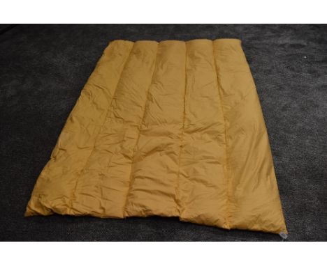 A plump vintage mustard yellow eiderdown.