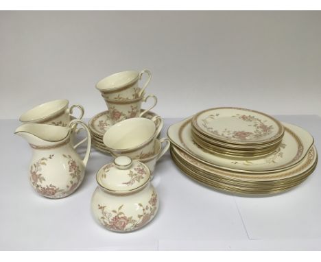 A Royal Doulton six place setting dinner and tea service in Lisette pattern.