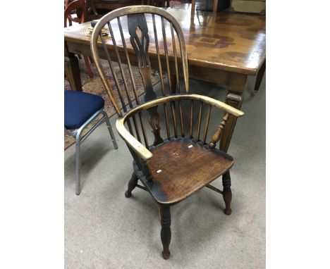 An elm seated stick back chair.