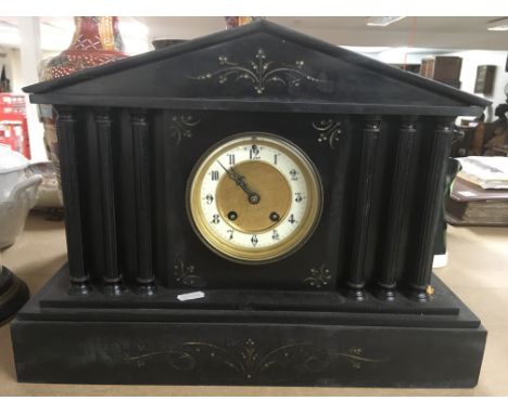 A large Victorian black slate mantle clock of Classical design.Approx 43x32cm high