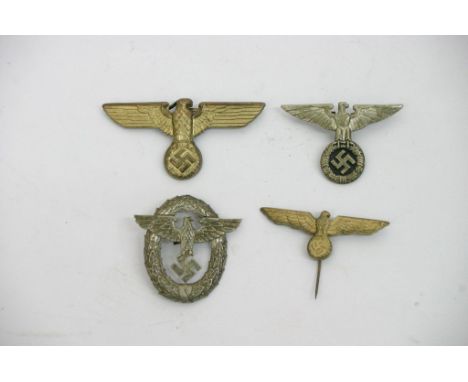 A Collection of four German Nazi insignia badges and stick pins including military police.