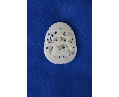 A jade pendant carved with the figure of a horse.