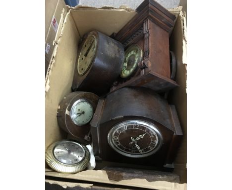A box of clocks including an 8 day mantle clock, vintage alarm clock etc.