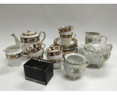 A decorative tea set, a boxed Wedgwood eggcup and a lustreware tea service.