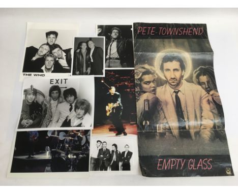 A collection of photographs of The Who and a Pete Townsend 'Empty Glass' poster.