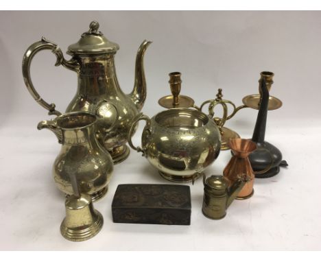 A collection of metalware including a three piece tea service, brass candelabra, stamp box and other items.