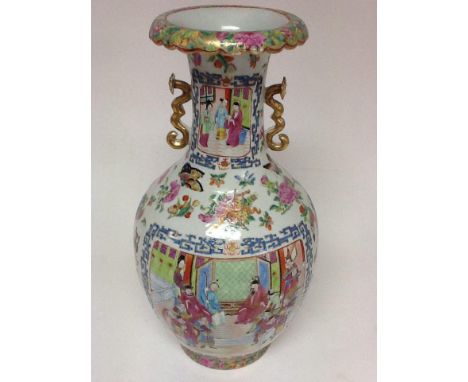A large Chinese famille rose vase with painted figural reserve panels and applied scroll handles.Approx 42cm high.