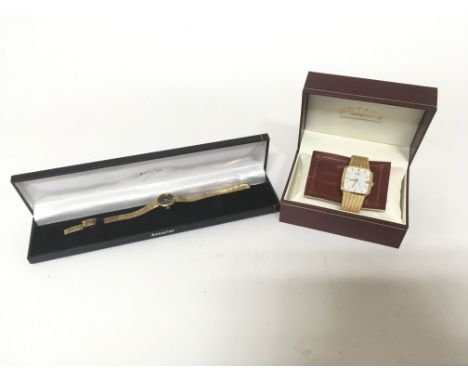 A boxed gents gold plated off-square Rotary wristwatch with date aperture, baton numerals and blue crown, alongside original 