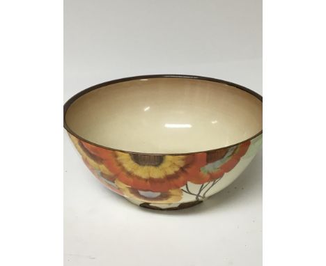 A wilkinson bowl decated with flowers and foliage in colours of orange yellow and brown