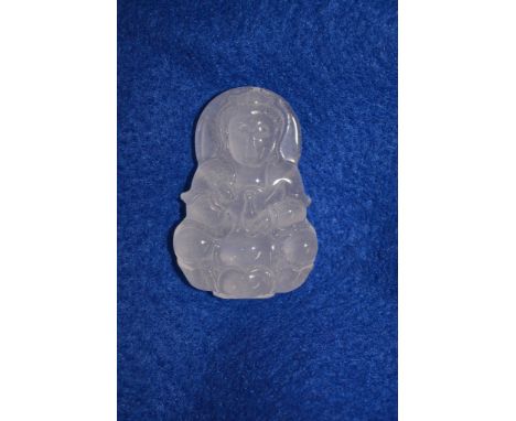 A small white jade carved pendant formed as a Buddha type figure.