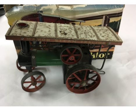 A boxed Mamod tractor engine.