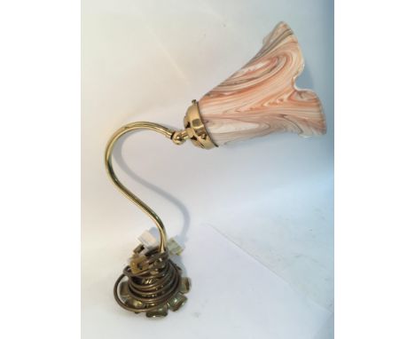 A brass side lamp with glass fluted shade