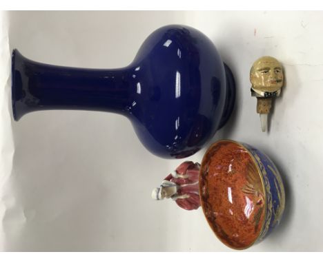 A Wedgwood lustreware bowl (a/f), a blue ceramic vase, Doulton figure and a ceramic bottle stopper in the form of Winston Chu