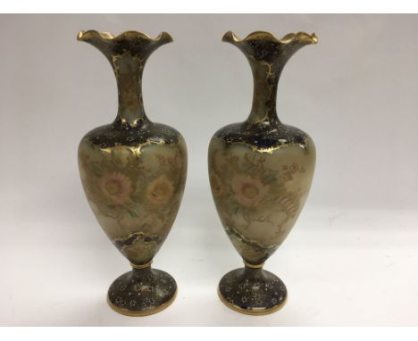 A pair of Carltonware frilled rim, footed vases with painted and gilded floral decoration. Approximately 29cm