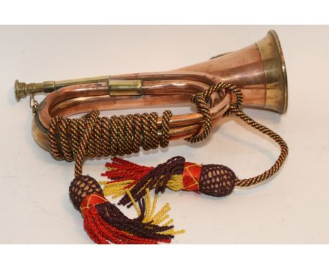 A copper and brass bugle with emblem for the Argyll and Sutherland highlanders.