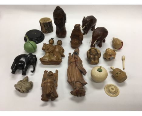 A box of mainly Oriental decorative ornamental odds including a carved netsuke.