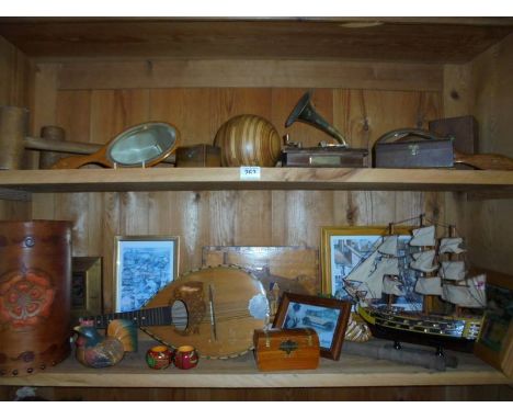 Two shelves of wooden items including police truncheon, inlaid picture, mandolin etc.,