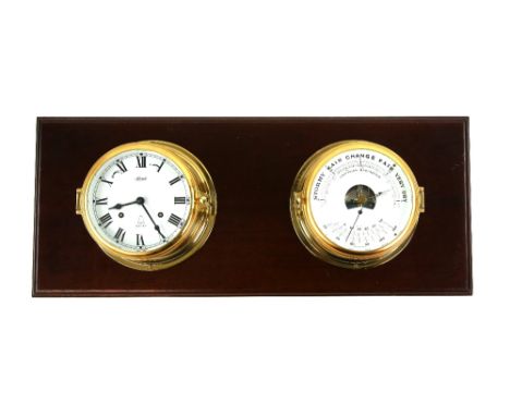 Hermle Ships Bell Bulkhead clock with 15cm dial, and a barometer mounted on a back board,.          Please see ewbanks.co.uk 