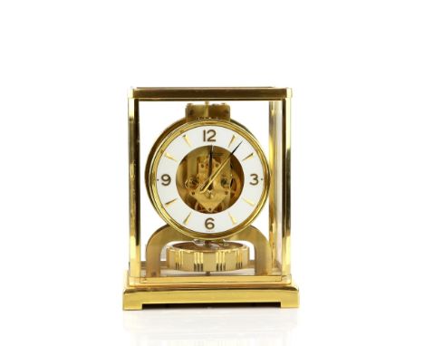 Jaeger-LeCoultre 'Atmos' clock, with a brass case with five glazed panels and a white circular dial, with dagger and Arabic n