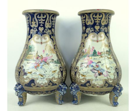 Pair of continental vases painted with hunting scenes in the Chinese Export style 50cm.          Please see ewbanks.co.uk for