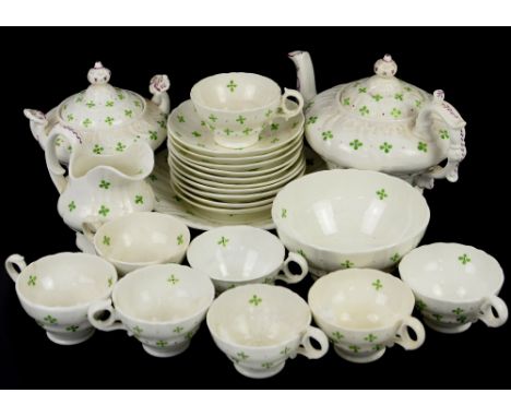 19th century Staffordshire tea service decorated with stylised green flowers, comprising teapot, sucrier, cream jug, eight cu