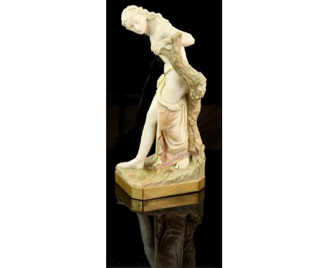 Royal Worcester figure of the Bather Surprised, after Thomas Brock, modelled as a classical female figure against a tree stum