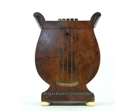 19th century mahogany lyre form tea caddy, the hinged top to reveal two sections, on ivory bun feet,  20cm x 16cm,PLEASE NOTE