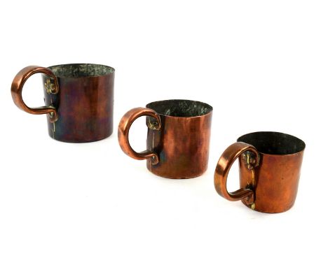 Two early 19th century copper rum measures, 1 pint and 1 gill, both with broad arrow marks, together with a Victorian 1/2 pin