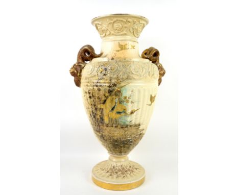 19th century Royal Worcester style blush ivory  vase with rams head handles  decorated with birds highlighted in gilt,  68cm 