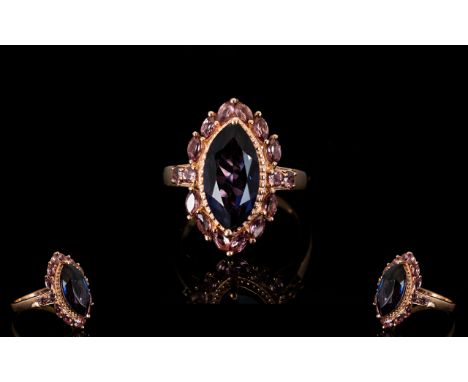 Colour Change Alexandrite Quartz and Rhodolite Garnet Ring, a 4ct marquise cut alexandrite quartz, having similar colour chan