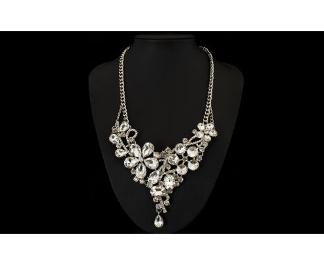 Austrian White Crystal Asymmetric Floral Necklace, an unusual necklace with a floral design made with a variety of large, bri