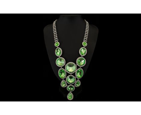 Apple Green Crystal Large Statement Necklace, a dramatic bib necklace composed of a variety of shapes and sizes of bright, sp