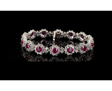 Ruby and White Topaz Cluster Line Bracelet, 30cts, comprising fourteen round cut rubies of rich red colour, each framed and i