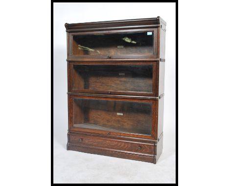 An Edwardian solid oak&nbsp; 3 section /&nbsp; tier lawyers - barristers stacking bookcase cabinet by&nbsp; Globe Wernicke. T