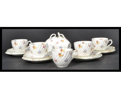 A vintage early 20th Century bone China tea service, hand painted design with makers marks to base.