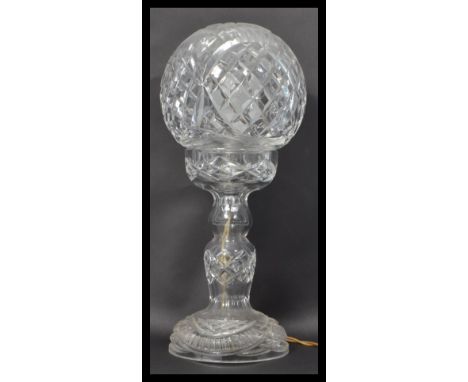 A 20th Century Art Deco period cut glass table lamp, cut glass orb shaped shade raised on a matching pedestal base.&nbsp;Meas