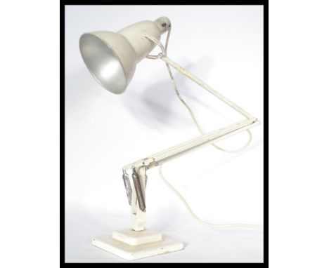 A 1940's Industrial pre-war Herbert Terry anglepoise lamp, raised on a cast metal two step base with pendant shade, finished 