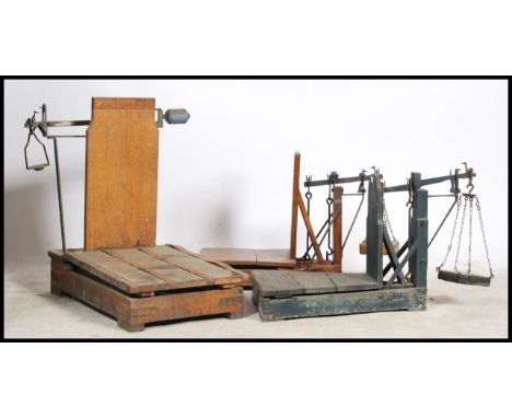 A collection of 3 19th / early 20th century Industrial farming scales - grain scales. Of wooden and cast iron construction, e