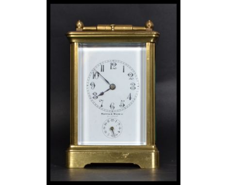 An early 20th century Mappin &amp; Webb brass carriage clock. The twin barrel movement with platform lever escapement, white 