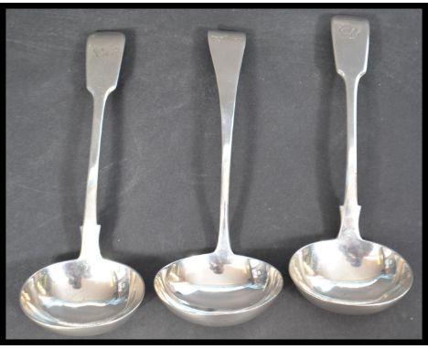 A group of three 19th century silver hallmarked sauce ladles to include a Victorian pair by William Robert Smiley hallmarked 