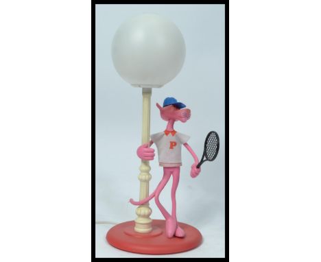 A vintage retro 20th century Pink Panther novelty lamp depicting the iconic character in sports wear with a tennis racket. 51