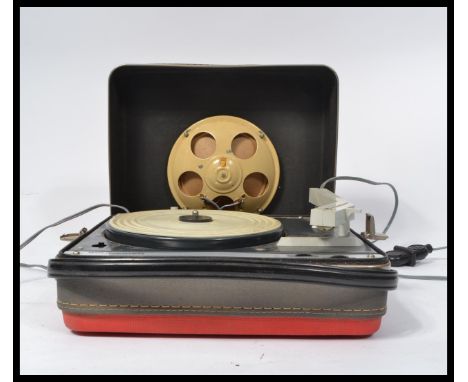 A vintage 20th Century two tone portable record player by Schneider, single speaker fitted to the removable lid with a four s