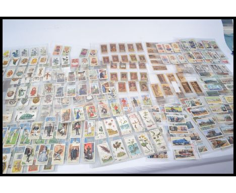 A shoe box of vintage cigarette cards including sets part sets and odd cards. Many hundred good quantity.