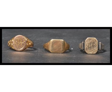 A group of three vintage early 20th century signet rings , two being 9ct gold and the other being 9ct gold and silver. Weight