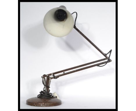 Two vintage retro 20th century anglepoise lamps one being a 1001 lamps example and the other in a brown finish with circular 
